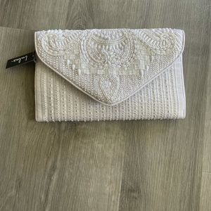 Lulu’s white beaded clutch